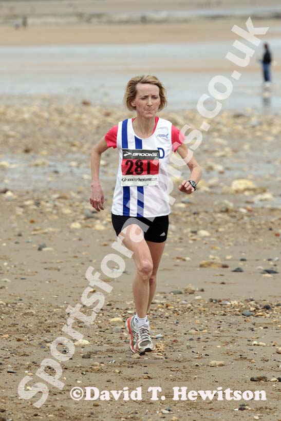 Sue Phillips (Darlington) finishing 2nd in the Pier to Pier Race, South Shields to Roker, Sunderland.